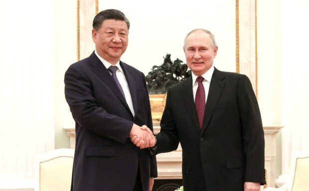 euters) - Vladimir Putin hosted his "dear friend" Xi Jinping for dinner at the Kremlin on Monday, showing off his relationship with his most powerful ally just days after an international court called for the Russian president's arrest for war crimes in Ukraine.Washington denounced Xi's visit, saying the timing indicated Beijing was providing Moscow with "diplomatic cover" to commit additional crimes. It was the first trip abroad for Xi since he obtained an unprecedented third term last month. The Chinese leader has been trying to portray Beijing as a potential peacemaker in Ukraine, as he deepens economic ties with his closest ally. Putin and Xi greeted one another as "dear friend" when they met in the Kremlin, and Russian state news agencies later reported they held informal talks for nearly 4-1/2 hours, with more official talks scheduled for Tuesday. In televised comments after they greeted each other, Putin told Xi he viewed China's proposals for a resolution of the Ukraine conflict with respect. He confessed to being "slightly envious" of China's "very effective system for developing the economy and strengthening the state". Xi, for his part, praised Putin and predicted Russians would re-elect him next year. "Under your strong leadership, Russia has made great strides in its prosperous development," he said. Moscow has been publicly promoting plans for a visit by Xi for months. But the timing gave the Chinese leader's personal support new meaning, after the International Criminal Court issued an arrest warrant on Friday accusing Putin of war crimes for deporting children from Ukraine. Moscow denies illegally deporting children, saying it has taken in orphans to protect them. It opened a criminal case against the court's prosecutor and judges. Beijing said the warrant reflected double standards. The West says the warrant should make the Russian leader a pariah. "That President Xi is travelling to Russia days after the International Criminal Court issued an arrest warrant for President Putin suggests that China feels no responsibility to hold the Kremlin accountable for the atrocities committed in Ukraine," U.S. Secretary of State Antony Blinken said. "Instead of even condemning them it would rather provide diplomatic cover for Russia to continue to commit those grave crimes.” White House spokesman John Kirby said Xi should use his influence to press Putin to withdraw troops from Ukraine, and Washington was concerned that Beijing might instead call for a ceasefire that would let Russian troops stay. China has released a proposal to solve the Ukraine crisis, largely dismissed in the West as a ploy to buy Putin time to regroup his forces and solidify his grip on occupied land. Russia and China "do not have the same network of friends and partners" around the world as the United States, and that's why they are tightening their relationship now, Kirby said. "It's a bit of a marriage of convenience, I'd say, less than it is of affection," Kirby told reporters. Washington has said in recent weeks it also fears China might arm Russia, which Beijing has denied. KYIV CAUTIOUS Kyiv, which says the war cannot end until Russia pulls out its troops, has been circumspect towards China, cautiously welcoming Beijing's peace proposal when it was unveiled last month even though Western allies were publicly sceptical. Ukrainian President Volodymyr Zelenskiy has said that China arming Russia could lead to World War Three, but also that he believed Beijing was aware of this risk, implying he thought it was unlikely. He has called for Xi to speak to him. Putin signed a "no limits" partnership with Xi last year shortly before the Kremlin leader ordered the invasion of Ukraine. Putin claims he aims to end a threat to Russia from its neighbour's moves towards the West; Kyiv and the West call it an unprovoked attack on an independent state. Russia's assault is believed to have killed tens of thousands of Ukrainian civilians and soldiers on both sides. Moscow has destroyed Ukrainian cities, set millions of people to flight and claims to have annexed nearly a fifth of Ukraine. The Kremlin said Putin would provide Xi with detailed "clarifications" of Russia's position, without elaborating. Several European Union countries agreed in Brussels on Monday to jointly buy 1 million rounds of 155 mm artillery shells for Ukraine. Both sides fire thousands of rounds per day. The United States announced its latest military aid package, worth $350 million, including more ammunition for HIMARS rocket launchers, howitzers and Bradley Infantry Fighting Vehicles, plus HARM missiles, anti-tank weapons and river boats. Fierce fighting continued in the eastern Ukrainian town of Bakhmut, where Ukrainian forces have held out since last summer in the longest and bloodiest battle of the war. Moscow, which has not scored a major victory since August, has launched a massive winter offensive involving hundreds of thousands of freshly called-up reservists and convicts recruited from jails. Fighting that both sides describe as a meat grinder has scattered the battlefield with bodies, but the front line has barely moved for more than four months. Ukraine, which recaptured swathes of territory in the second half of 2022, has kept mainly to defence since November, aiming to deplete Russia's attacking forces before launching a planned counteroffensive of its own.