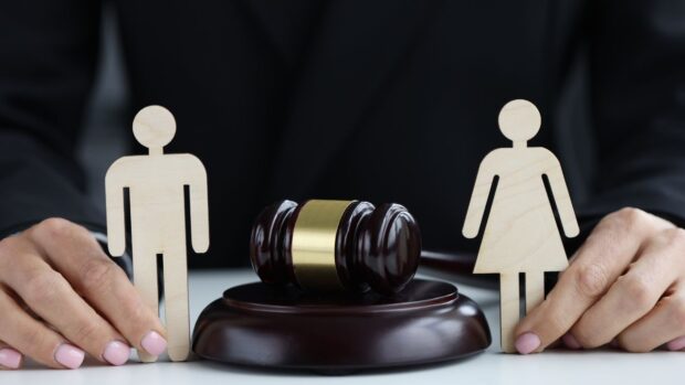 Stock photo of hands holding cutout male and female figures STORY: Bill adds more grounds for legal separation
