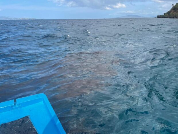 The oil spill has been spotted within the vicinity waters of Barangay San Agapito in Verde Island, Batangas on Monday morning. (Photo from the Philippine Coast Guard.)