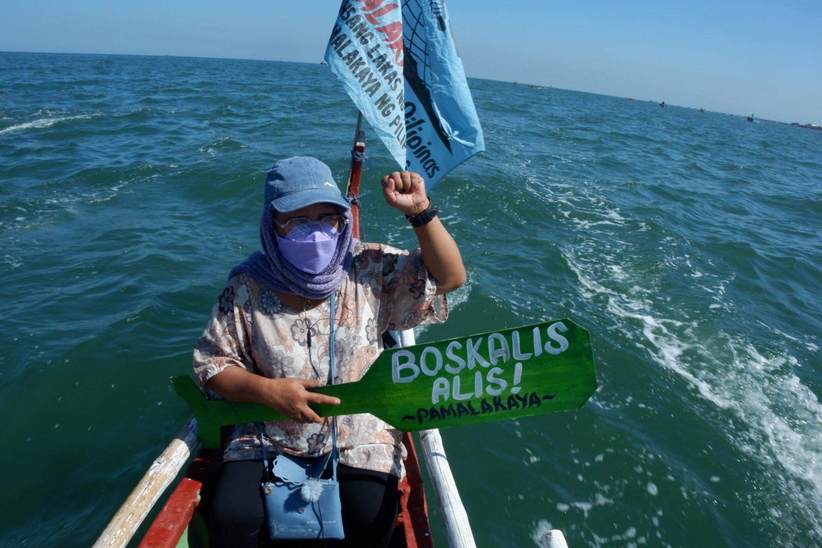 At least 11 fisherfolk stage a fluvial protest against dredging activities in Manila Bay on Tuesday, March 14, 2023.