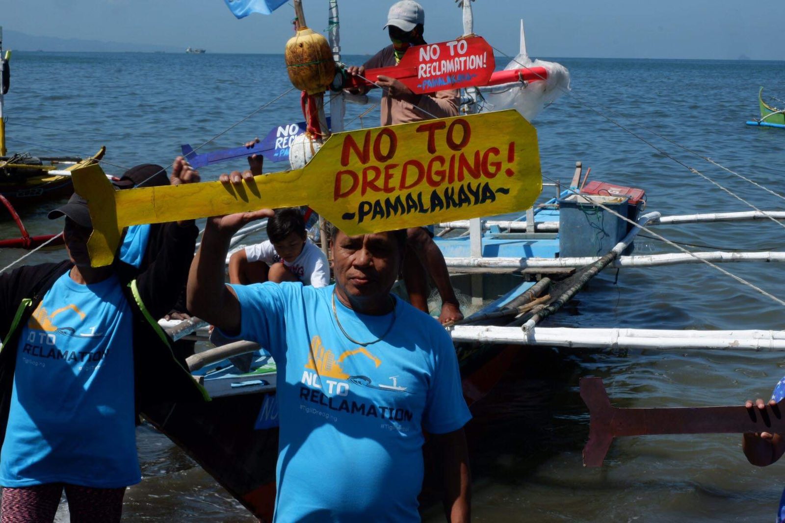 At least 11 fisherfolk stage a fluvial protest against dredging activities in Manila Bay on Tuesday, March 14, 2023