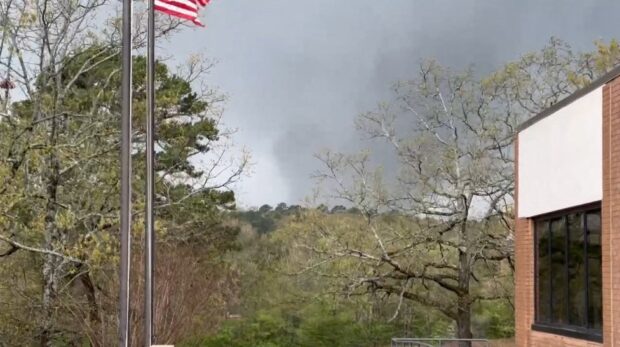 This framegrab from a video provided by Lane Hancock on March 31, 2023 shows a tornado brewing in Little Rock, Arkansas. - A large tornado tore through Arkansas on Friday causing "significant damage," the governor of the southern US state tweeted, as rescuers rushed to aid residents and hospitals said they were bracing for casualties. (Photo by Lane Hancock / HANDOUT / AFP) / RESTRICTED TO EDITORIAL USE - MANDATORY CREDIT "AFP PHOTO /  Lane Hancock " - NO MARKETING NO ADVERTISING CAMPAIGNS - DISTRIBUTED AS A SERVICE TO CLIENTS