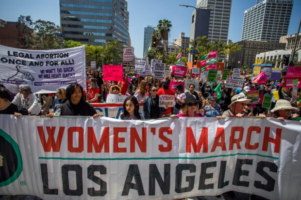 People take part in a march for abortion rights from Pershing Square to City Hall in Los Angeles, April 15, 2023. - The US Supreme Court on April 14 temporarily preserved access to mifepristone, a widely used abortion pill, in an 11th-hour ruling preventing lower court restrictions on the drug from coming into force. (Photo by Apu GOMES / AFP)