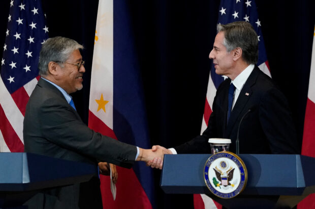 Philippine Secretary of Foreign Affairs Enrique Manalo and US Secretary of State Antony Blinken shake hands at the end of a joint press availability at the State Department in Washington, US, April 11, 2023. 