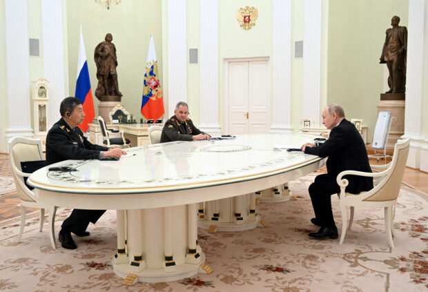 Russian President Vladimir Putin, Defence Minister Sergei Shoigu and Chinese Defence Minister Li Shangfu attend a meeting in Moscow, Russia, April 16, 2023. Sputnik/Pavel Bednyakov/Pool via REUTERS