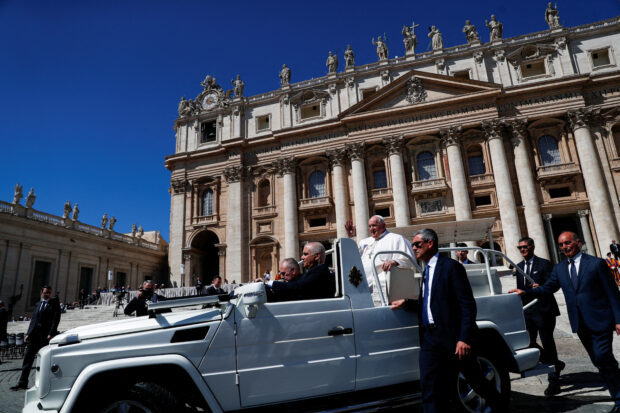 Pope Francis leaves following the weekly general audience in St. Peter's Square at the Vatican April 26, 2023. REUTERS/Guglielmo Mangiapane