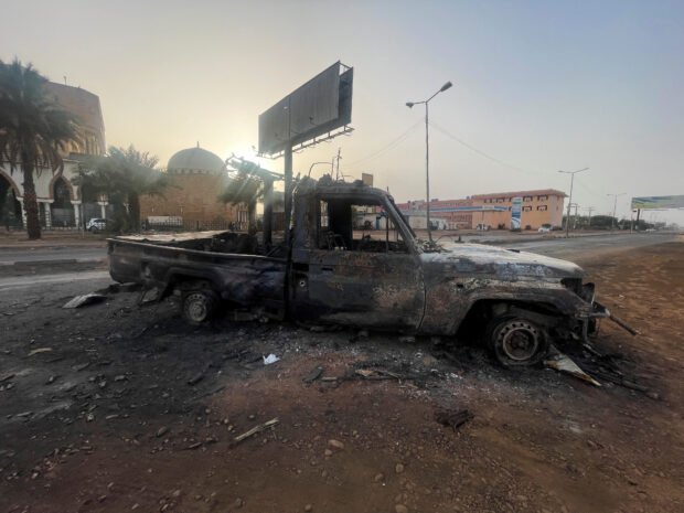 A burned vehicle is seen in Khartoum, Sudan April 26, 2023. REUTERS/El-Tayeb Siddig