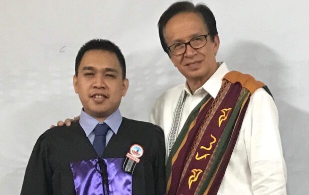 University of Baguio’s Anthony Mark Dulawan Emocling (left) who despite being blind hurdled the 2022 Bar examination. 