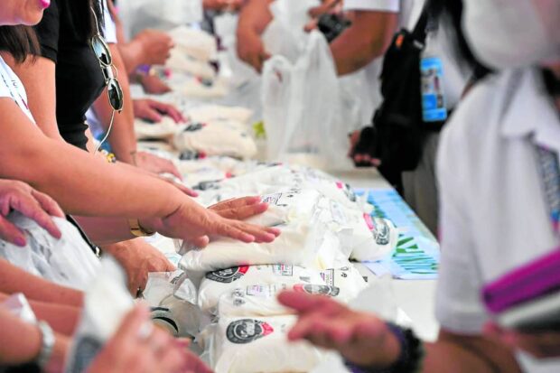 PRIZED COMMODITY Refined sugar sells for only P70 a kilo during the April 3 launching of the affordable sugar program at the Bacolod City government center. —BACOLOD CITY PUBLIC INFORMATION OFFICE PHOTO