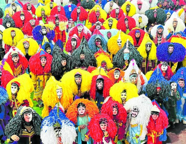 ‘ROMAN SOLDIERS’ IN VARYING HUES The parade of “centurions” (Roman foot soldiers) wearing colorful masks and costumes in General Luna, Quezon province, on Holy Monday has attracted tourists to the town. —PHOTO COURTESY OF MAYOR MATT ERWIN FLORIDO