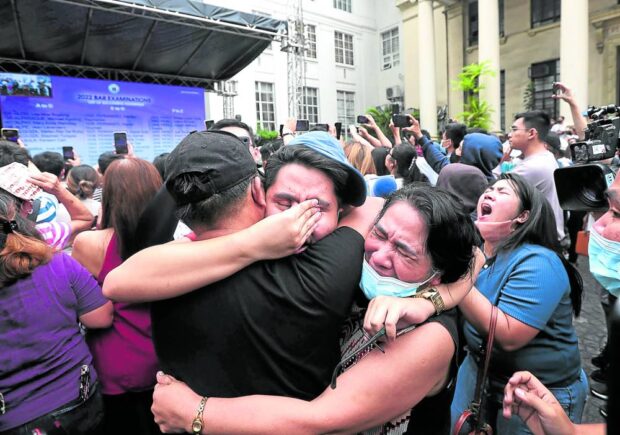Bar passers celebrate with their loved ones on the Supreme Court grounds as the tribunal announced the results of the 2022 exams on Friday. A total of 3,992 out of 9,183 takers made the cut.  bar exam