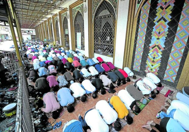 Muslims gather for prayers at the Golden Mosque in Quiapo, Manila, on Friday afternoon. The Islamic community will be marking Eid al-Fitr, or the “Feast of Breaking the Fast,” to mark the end of Ramadan today as there was no still no sighting of the crescent moon as of Thursday. 