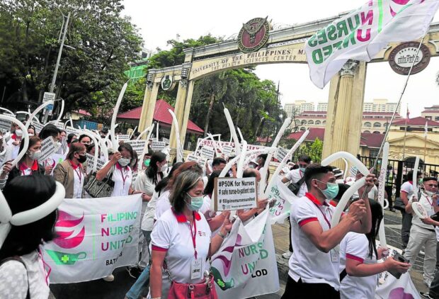 UNDERPAID Members of Filipino Nurses United stage a protest rally at the UP-PGH in Manila to call for a P50,000 entry level salary for nurses. —MARIANNE BERMUDEZ