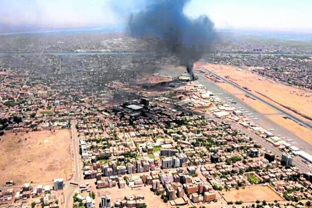 Black smoke rises above Khartoum International Airport 