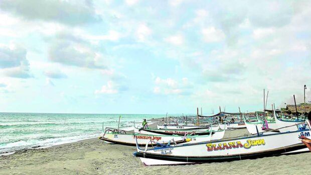 Boats sit idle along the coast of Barangay San Miguel in San Antonio, Zambales  fishers afp aid