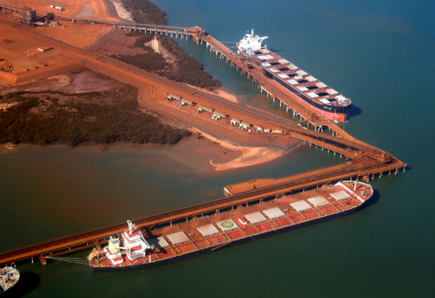 Ships waiting to be loaded with iron ore are seen at the Fortescue loading dock located at Port Hedland