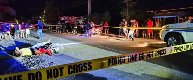 Construction worker Summy Udang lies dead along the road in Barangay San Miguel, Digos City after he was shot at close range on Friday night. (Photo from Digos City Police)