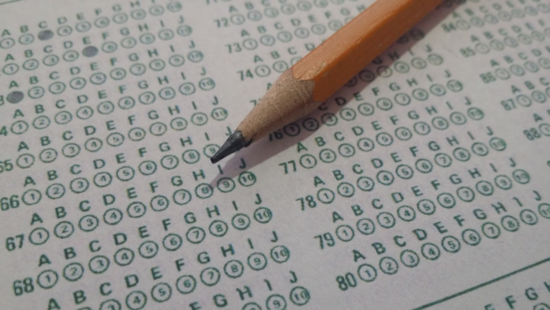 STOCK PHOTO of pencil over a multiple-choice paper. STORY: Private schools balk at looming ban on ‘no permit, no exam’ policy