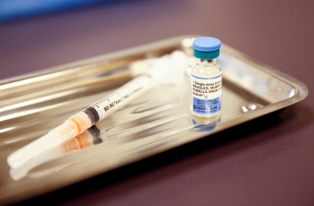 FILE PHOTO: A vial of the measles, mumps, and rubella (MMR) vaccine is pictured at the International Community Health Services clinic in Seattle