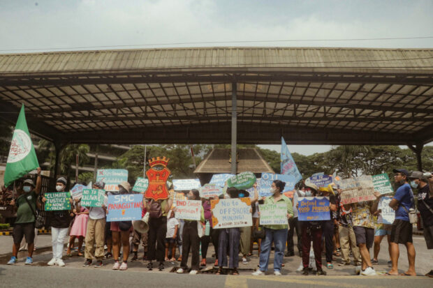 Fisherfolk and climate justice advocates stage an anti-reclamation protest outside the SMC head office on Earth Day. / Sofia Abrogar