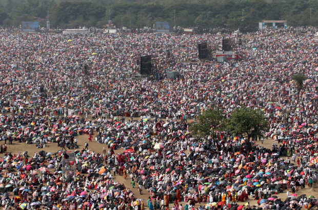 People attend an award function during a hot day on the outskirts of Mumbai