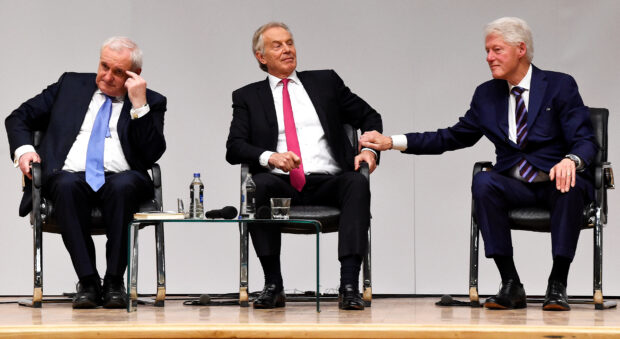 FILE PHOTO: Bertie Ahern, Tony Blair and Bill Clinton attend an event to celebrate the 20th anniversary of the Good Friday Agreement, in Belfast