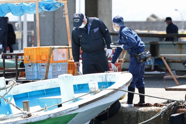 Police officers investigate Saikazaki port, where Japan's Prime Minister Fumio Kishida was evacuated unharmed from the scene of an apparent "smoke bomb" blast a day before, in Wakayama on April 16, 2023. (Photo by JIJI PRESS / AFP) / Japan OUT