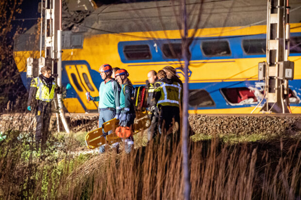 A general view shows rescue operations underway following the derailment of a passenger train after it hit construction equipment on the track, in Voorschoten