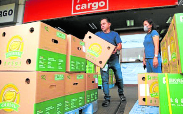 Bound for Nanning City in China boxes of locally grown durian are prepared for shipment at Davao International Airport on Thursday, April 6, 2023. STORY: PH exports smelly, sweet durian to China for first time