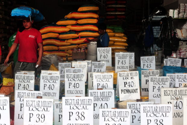NO SIGN OF SHORTAGE Regular and well-milled rice sold at astore in Cubao, Quezon City, last week. —GRIG C. MONTEGRANDE