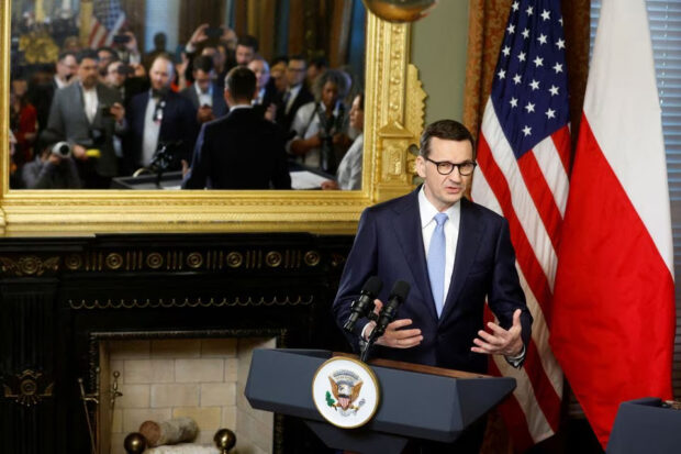 Polish Prime Minister Mateusz Morawiecki delivers remarks with U.S. Vice President Kamala Harris before their meeting in her ceremonial office in the Eisenhower Executive Office Building on the White House campus in Washington, D.C., U.S. April 11, 2023 china polish 