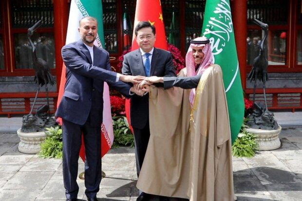This handout picture provided by the Iranian foreign ministry shows Iran's Foreign Minister Hossein Amir-Abdollahian (L) shaking hands with Saudi Foreign Affairs Minister Prince Faisal bin Farhan and Chinese Foreign Minister Qin Gang (C) during a meeting in Beijing on April 6, 2023. - The foreign ministers of Middle East rivals Iran and Saudi Arabia met in Beijing, paving the way for normalised ties under a surprise China-brokered deal. (Photo by Iranian Foreign Ministry / AFP) / === RESTRICTED TO EDITORIAL USE - MANDATORY CREDIT "AFP PHOTO / HO / IRANIAN FOREIGN MINISTRY" - NO MARKETING NO ADVERTISING CAMPAIGNS - DISTRIBUTED AS A SERVICE TO CLIENTS ===