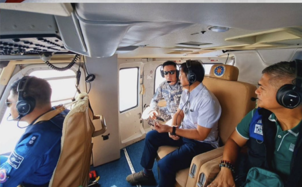 President Ferdinand Marcos Jr. conducts an aerial survey of areas struck by the oil spill in Oriental Mindoro on Saturday, April 15, 2023. Photo from Bongbong Marcos’ Instagram. 