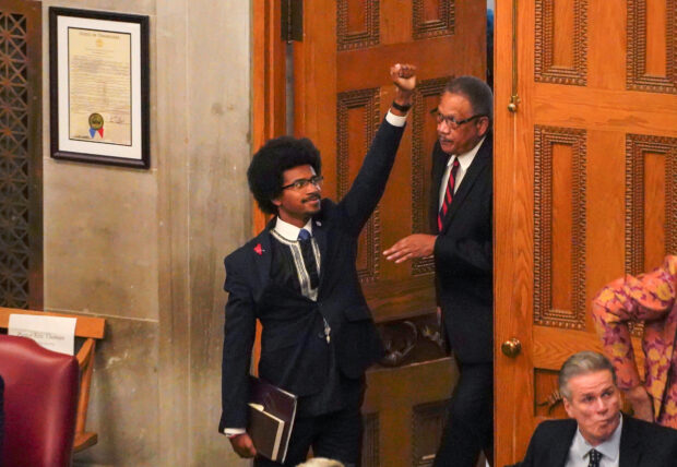 Rep. Justin Pearson gestures while entering the statehouse, as Republicans who control the Tennessee House of Representatives prepare to vote on whether to expel three Democratic members for their role in a gun control demonstration at the statehouse last week, in Nashville, Tennessee, U.S., April 6, 2023. REUTERS/Cheney Orr