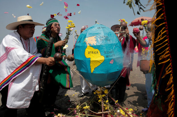 FILE PHOTO: Peru's shamans perform a traditional ritual and make an offer to "Pachamama" (Mother Earth) on the eve of "Earth Day", in Lima