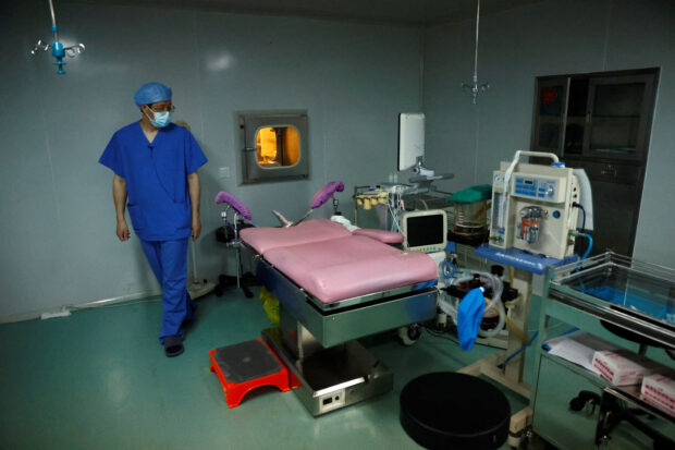 Doctor Xu Xiaoming, director of the embryologic laboratory of the assisted reproductive centre, shows the room for egg retrieval surgery, at the Beijing Perfect Family Hospital in Beijing