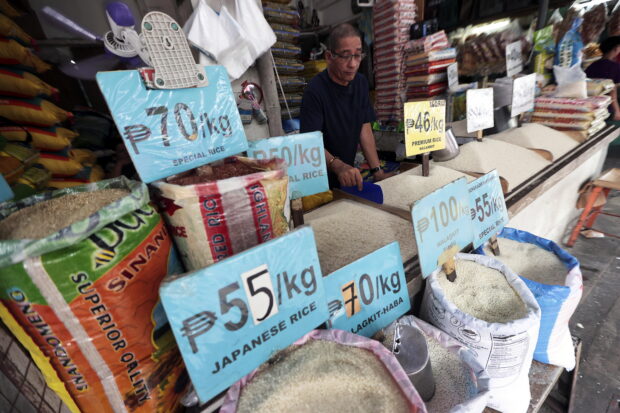 Ramon Saner looks after his rice stall in Quezon City in this photo taken on Jan. 17, 2023 STORY: Rice prices expected to rise – DA