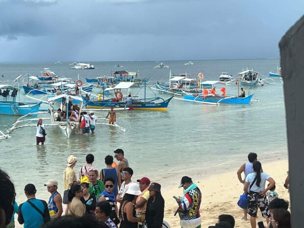 Tourists wait for their turn to an island-hopping trip. Photos courtesy of General Luna Mayor Sol Matugas