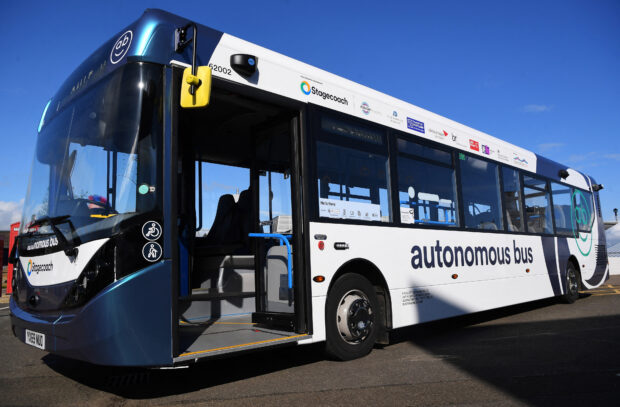 A bus that will be used for the CAVForth autonomous bus service, AB1, is pictured during a press preview in Queensferry, Scotland on May 11, 2023. The service, set to be the first registered service in the UK to use full-sized autonomous buses, will have two members of staff on board -- a Safety Driver in the driver's seat to monitor the technology, and a 'Captain' in the saloon to take tickets and answer customers questions. (Photo by Andy Bucha)
