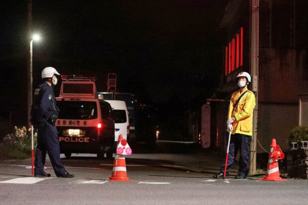 Japanese police detain a suspect who had been holed up in a building after allegedly killing four people