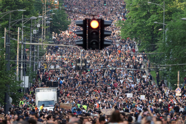 Tens of thousands marched through Belgrade on May 19 in an anti-government protest following two mass shootings that killed 18 people.