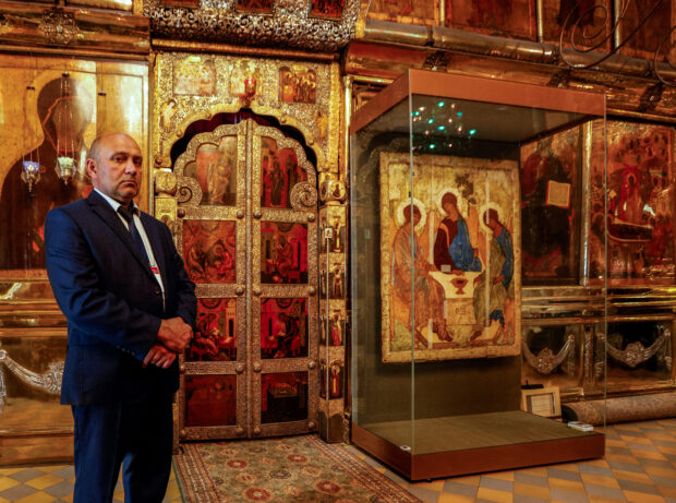 A Russian Orthodox Church fires its expert on art and restoration for obstructing the transfer of a historic 15th-century Trinity icon to the Church from a Moscow museum.