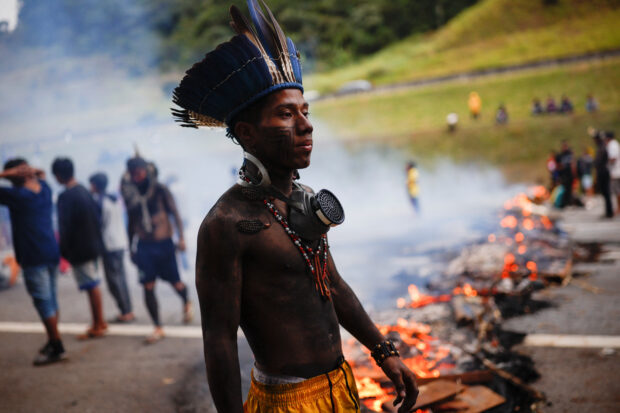 Indigenous groups in Brazil block a highway and burn tires to protest a proposed law that would limit their ability to win protected status for ancestral lands.