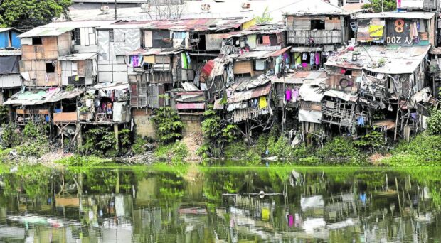 LIVING DANGEROUSLY The poor in urban areas live in shanties like these along the Manggahan floodway in Pasig City. —INQUIRER FILE PHOTO