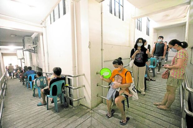 Residents of Pasig City line up for COVID-19 vaccination at Rosario Super Health Center in Pasig City. STORY: Daily tally of new COVID cases again tops 2,000