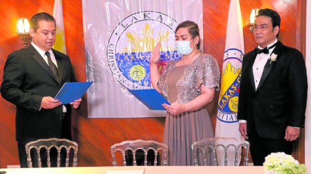 Then Davao City Mayor Sara Duterte is sworn in as a member of the Lakas-Christian Muslim Democrats party on Nov. 11, 2021, the same party she decided to leave following the demotion of former president and now Pampanga Rep. Gloria Macapagal-Arroyo as a House leader on Thursday. 