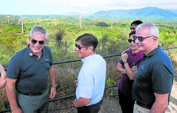 HARNESSING ILOCANDIA AIR President Marcos views the newly constructed wind farm in Pagudpud, Ilocos Norte, together with his son, Ilocos Norte Rep.  Sandro Marcos, Ayala Corp. chair Jaime Augusto Zobel de Ayala (left) and Ayala Land adviser Fernando Zobel de Ayala. Mr. Marcos led the inauguration of the Ayala project in his home province on Friday. —MARIANNE BERMUDEZ