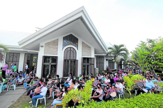 Pilgrims and tourists wait for their turn to visit “Domus Teofilo” in Carcar City, Cebu, where the remains of Archbishop Teofilo Camomot are interred. A museum featuring the prelate’s belongings and other materials and documents on his service to the Church and his flock gives visitors a glimpse of his life. STORY: Pilgrims find hope in tomb of Cebu bishop