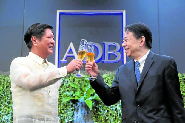 Ferdinand Marcos Jr. and Masatsugu Asakawa STORY: Marcos vows efficient use of ADB loans, tech aid.