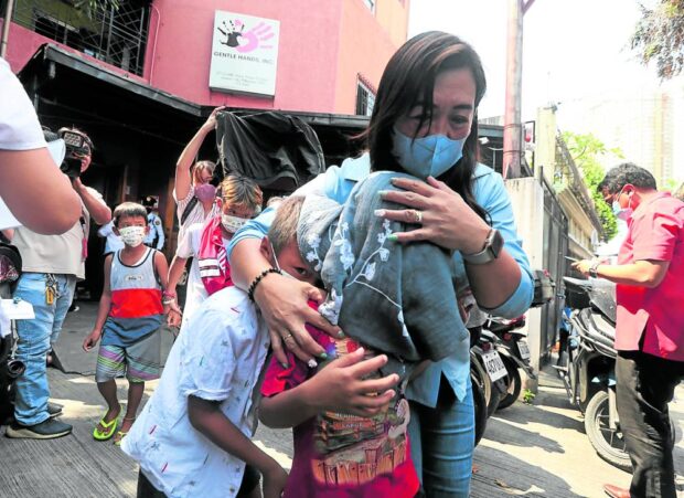 ORPHANED, HOMELESS More than 200 orphans are moved out of the private orphanage Gentle Hands Inc. after it was shut down on Tuesday by the Department of Social Welfare and Development due to various violations.  —MARIANNE BERMUDEZ